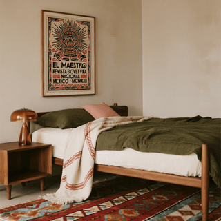 Bedroom with wooden bed, nightstand, and decorative poster on wall