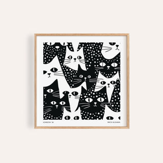 Cat Art Black and White of abstract black and white cat faces with spots and stripes in a wooden frame