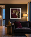 Modern living room with a dark gray sofa, decorative pillow, and a framed picture of a leopard on the wall.