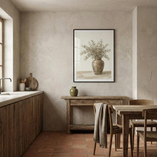 Nest interior with wooden furniture, a vase, and a framed picture on a beige wall.