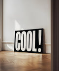 Minimalist black and white wall art with the word &quot;COOL&quot;