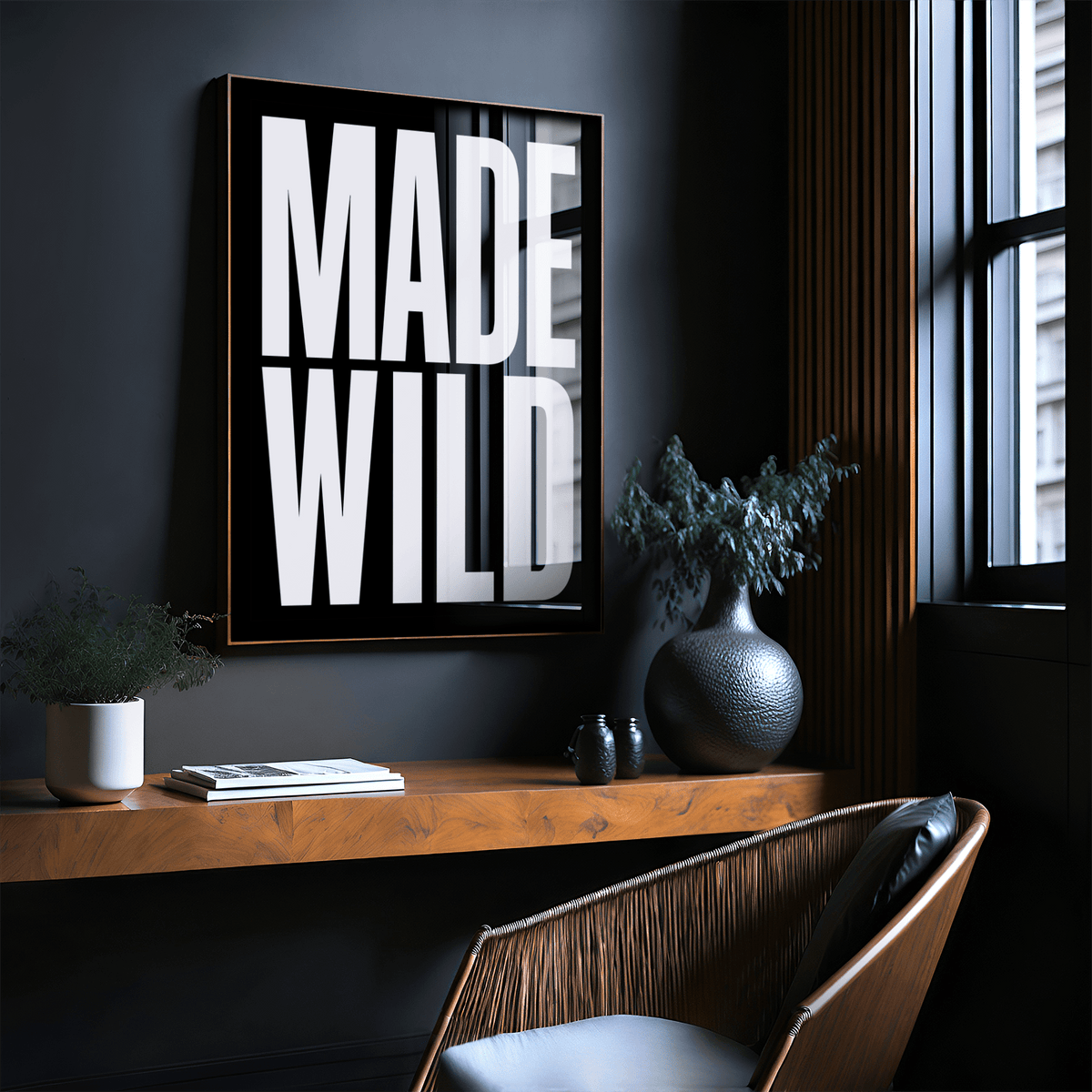 Modern typographic wall decor displayed above desk workspace