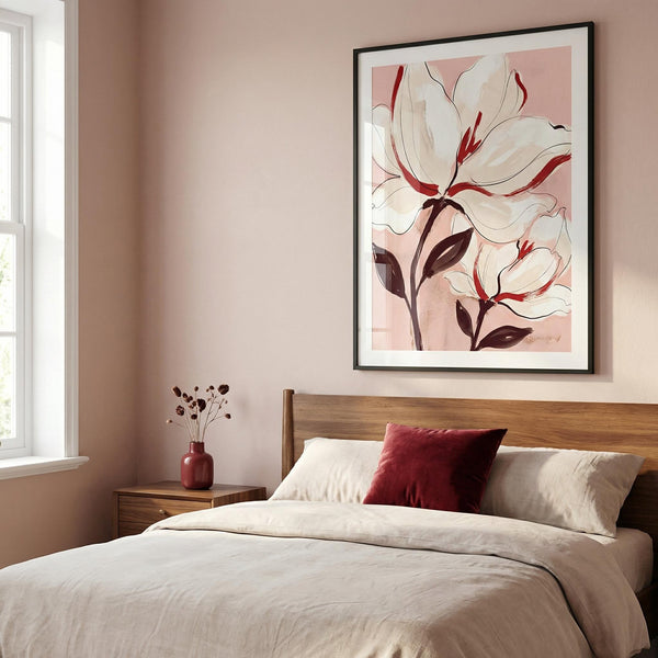 Bedroom with floral artwork on the wall, a bed with pillows, and a vase on a nightstand.