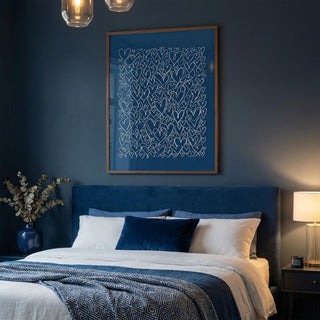 Bedroom with blue walls, a bed with white and blue bedding, and decorative elements.