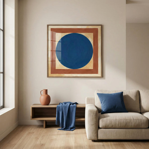 Modern living room with a blue circular artwork on the wall, beige sofa, and wooden side table.