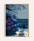 Framed Japanese Rain Print poster showing hydrangeas, stepping stones, and diagonal rainfall lines