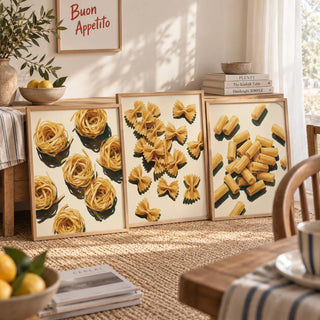 Framed fettuccine, farfalle and rigatoni pasta prints leaning against a wooden sideboard in a warm dining room. Frames not included.