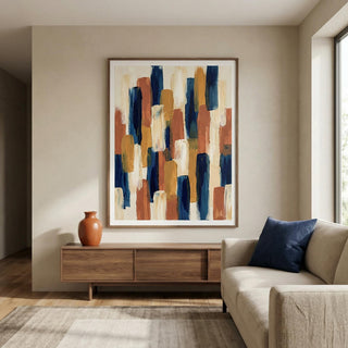 Living room with abstract art, wooden cabinet, and beige sofa.