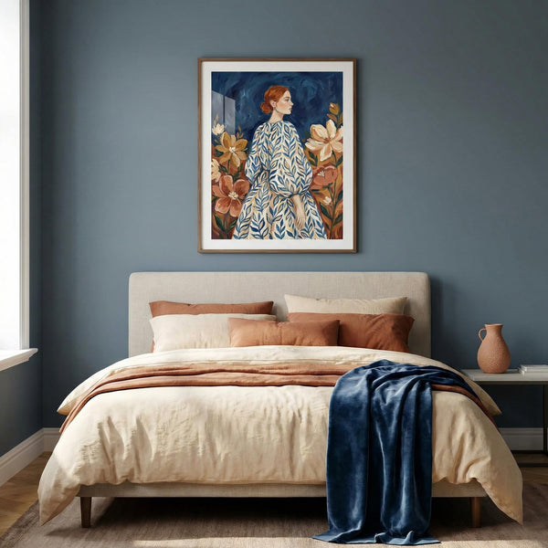 Bedroom with a bed, pillows, and a painting on the wall.