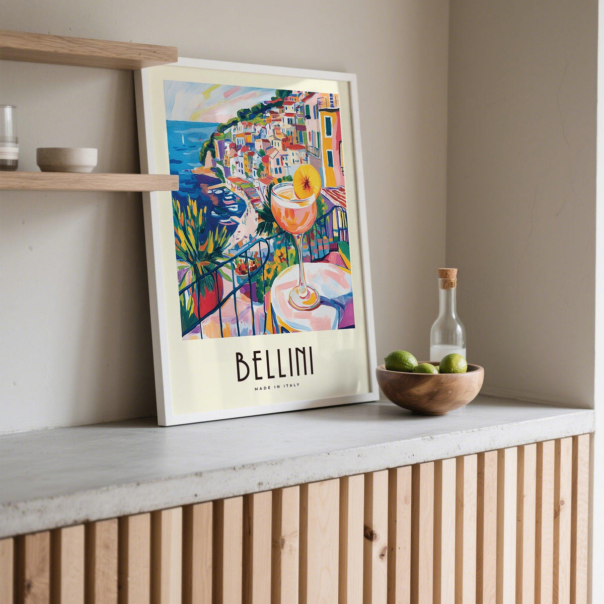 Bright Bellini glass in foreground of Italian Style Cocktail Wall Art coastal setting.