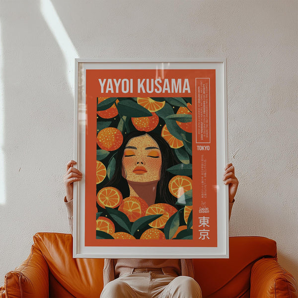 Cool wall art with oranges and a serene woman’s face in bold orange and green.