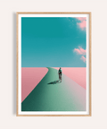 Framed mockup of Surreal Cycling Art Print poster with lone cyclist on a curved road under clouds