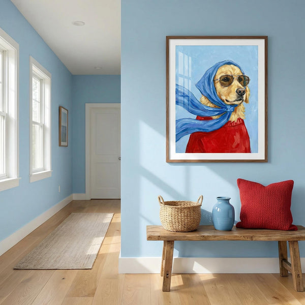 Room interior with a framed painting of a dog wearing a blue headscarf and red outfit, wooden bench with decorative items, and light blue walls.