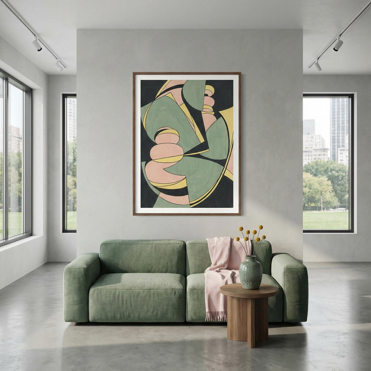 Modern living room with a green sofa, abstract art on the wall, and a small table with decor items.