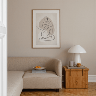 Seated figure composed from one fluid line over organic background shapes