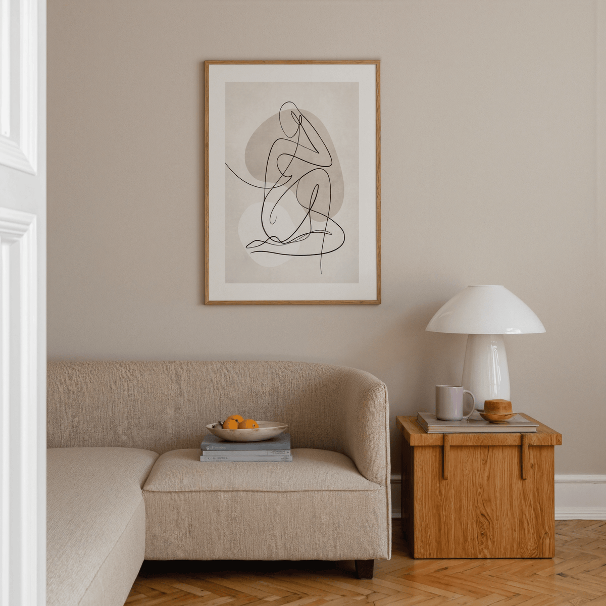 Seated figure composed from one fluid line over organic background shapes