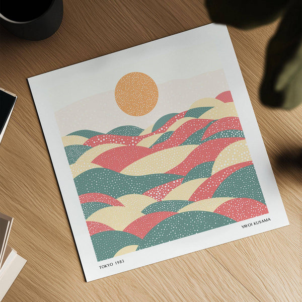 Warm-toned polka dot artwork featuring textured hills and celestial elements