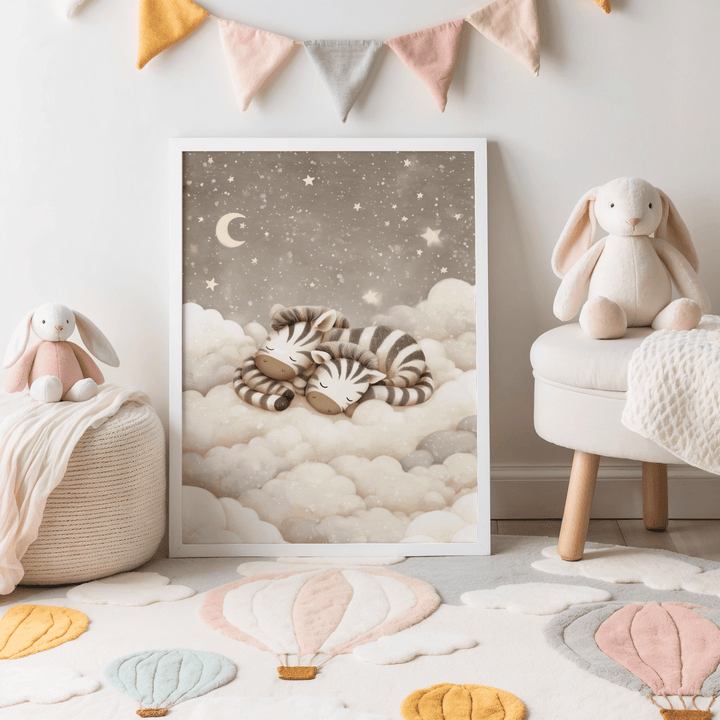 Print leaning on a rug with hot air balloons and stuffed bunnies showing sleeping baby zebras in soft beige and grey tones