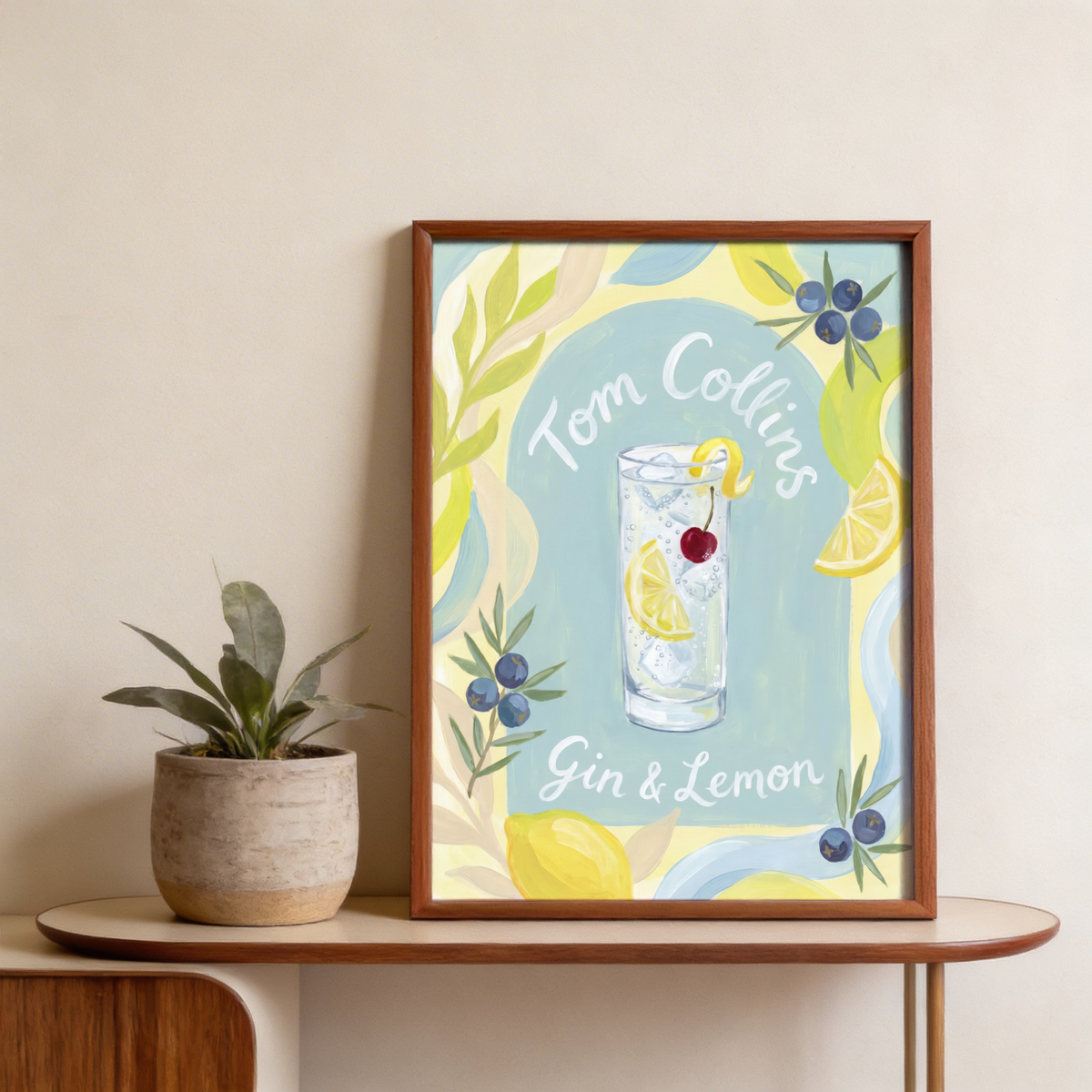 Hand-lettered Tom Collins Art Print with tall glass, citrus slices border, and leafy accents