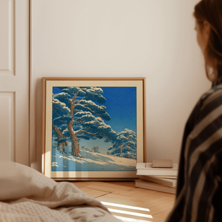 Gallery-style photo of Hasui Kawase snowy pines art print with subtle border