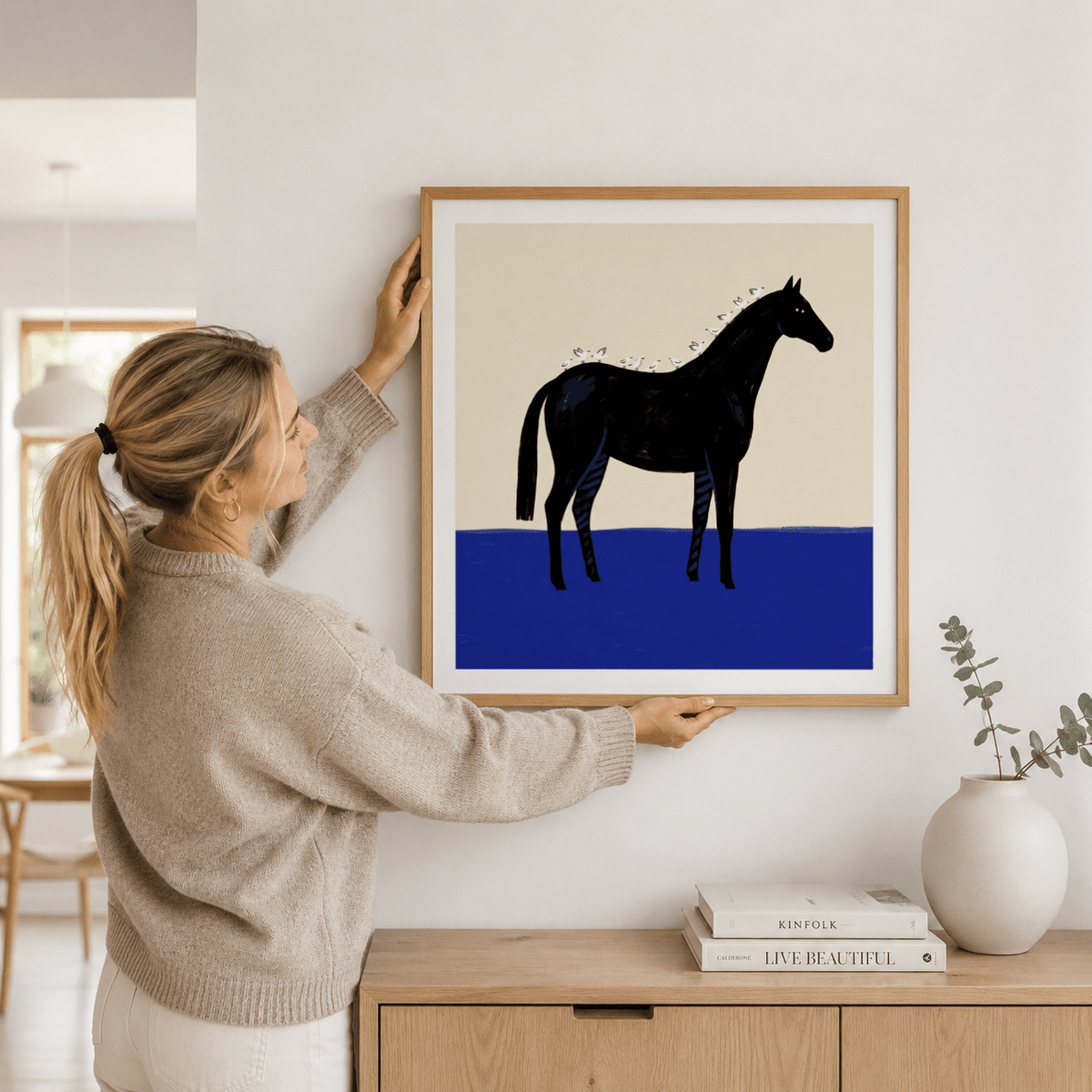 Minimalist square illustration of black horse in modern interior