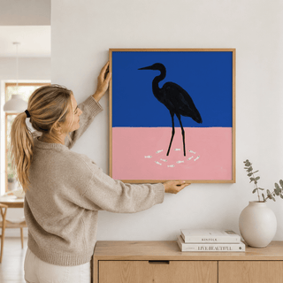 Gallery wall arrangement highlighting minimalist Heron Art Print in black frame