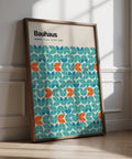 Graphic wall art with teal, blue, and orange Bauhaus-style geometric shapes.