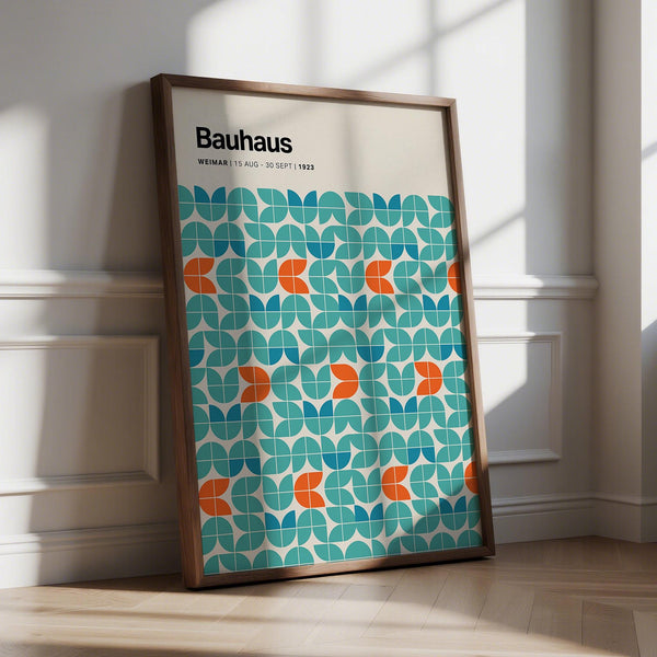 Graphic wall art with teal, blue, and orange Bauhaus-style geometric shapes.