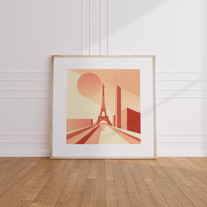 Eiffel Tower Poster Wall Art leaning against a white wall on wooden floor in soft peach and beige tones