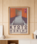 Close-up print detail showing stacked shrine gate columns and vanishing-point walkway in Kyoto poster art