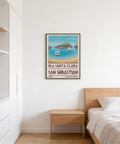 Typography travel wall art poster with large San Sebastian lettering beneath a minimalist sea and sailboats