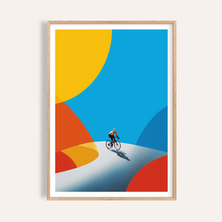 Framed cycling art print with minimalist cyclist on a winding road and bright blue and yellow shapes