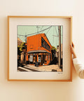 Square-format retro Japanese wall art with an orange Tokyo street scene