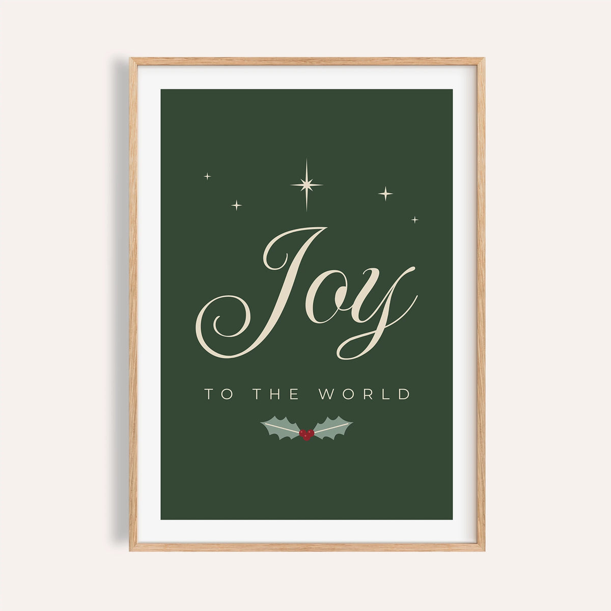 Joy to the World Christmas print in forest green and cream on a plain wall