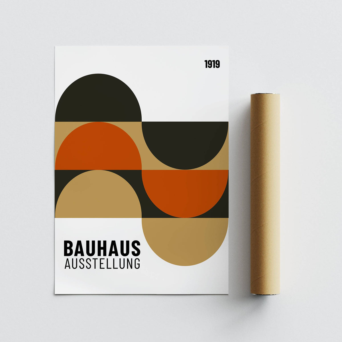 Artwork for the Wall showing abstract geometric shapes in black, orange and brown beside a packaging tube on a white surface