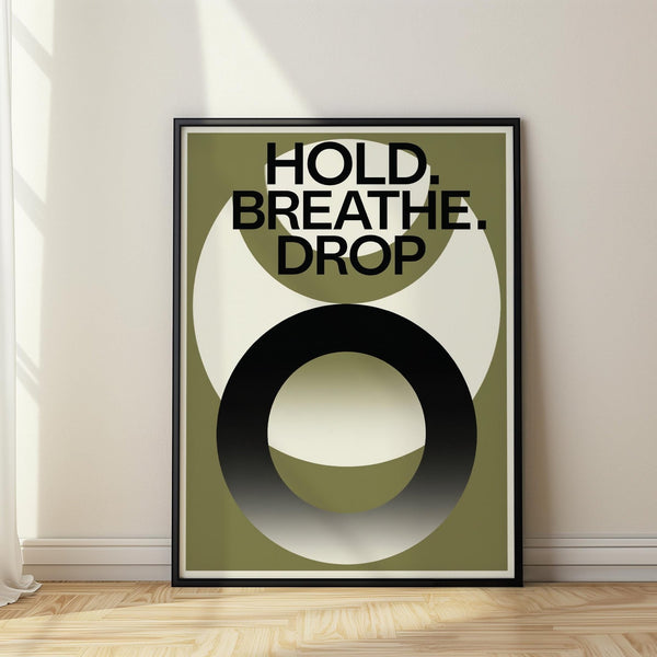 Home gym wall art with Hold Breathe Drop quote in bold typography.