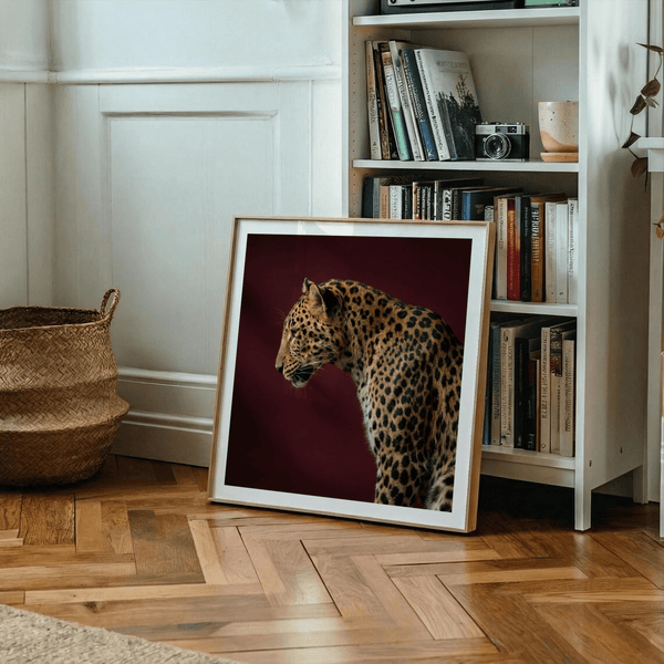 Side-view leopard wall art showing defined ear silhouette and sharp fur texture
