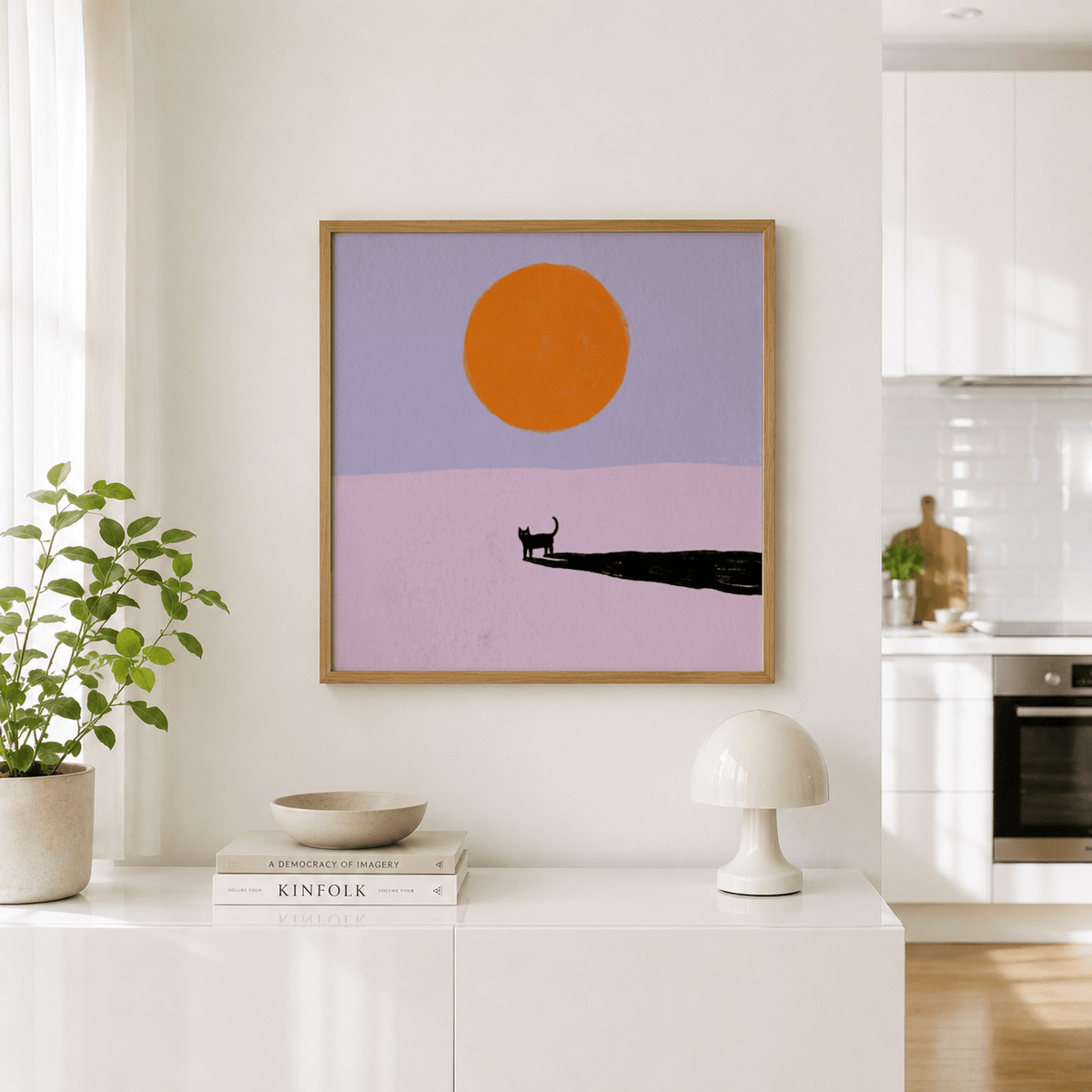 Room scene showing a minimalist cat poster with cat silhouette, sun circle, and long shadow across the lower area