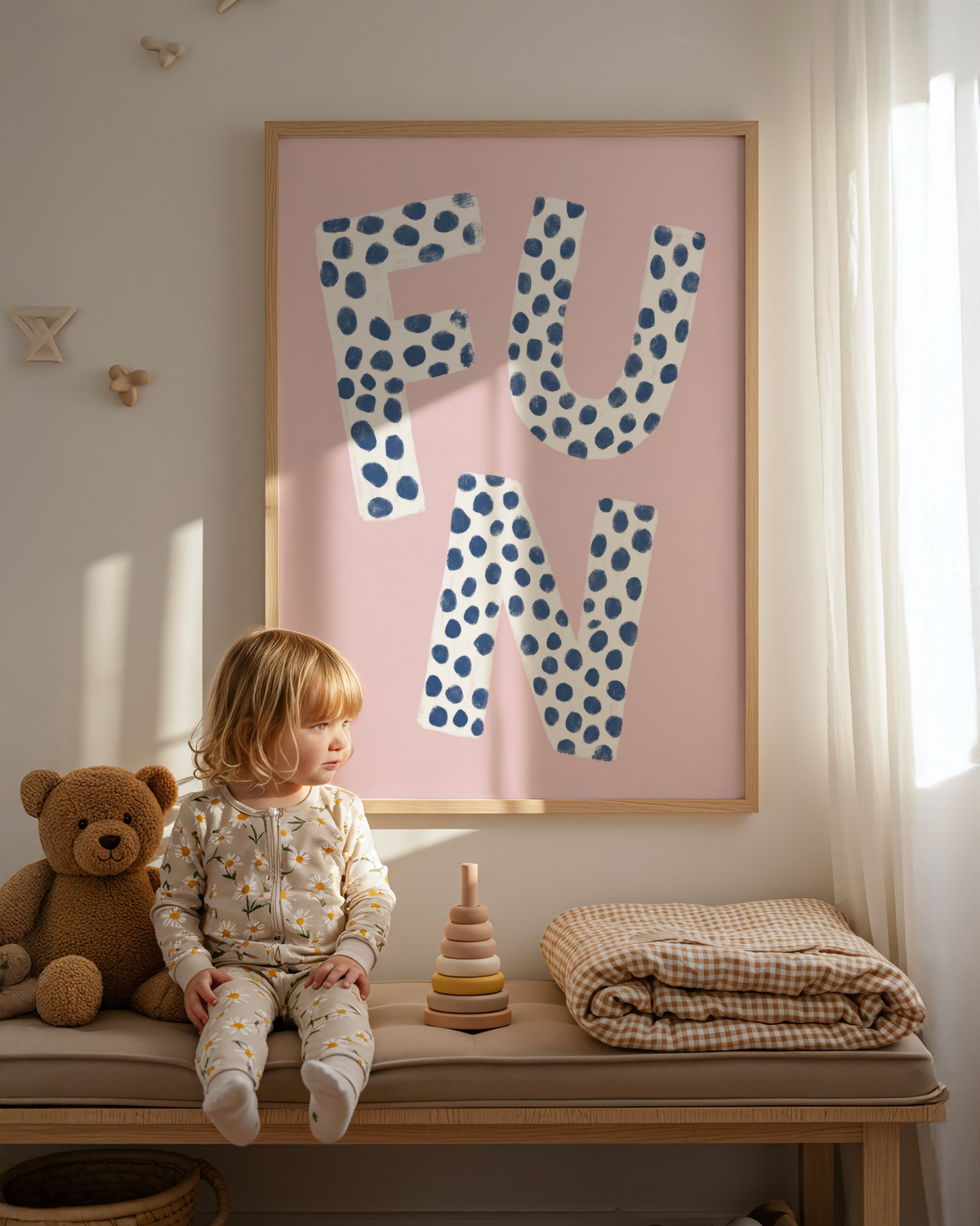Hand-drawn letterform poster featuring FUN text in spotted pattern and soft pink backdrop