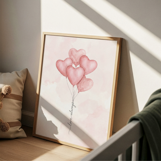 Floating heart-shaped balloons wall art with cursive word on the string
