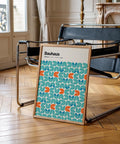 Teal and orange abstract graphic wall art in geometric tile formation.