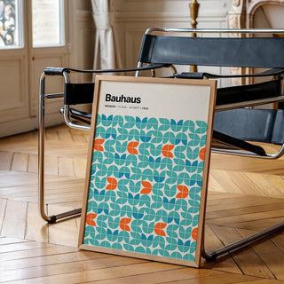 Teal and orange abstract graphic wall art in geometric tile formation.