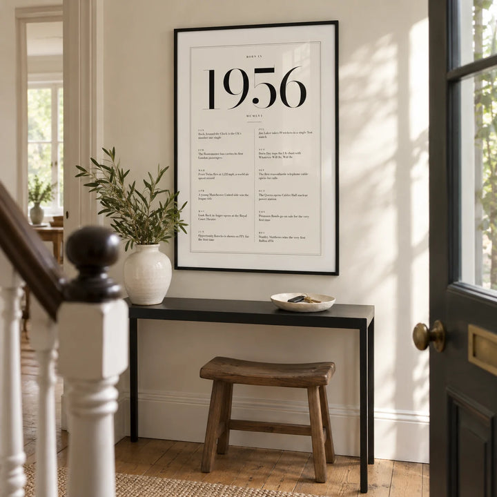 1956 Birthday Print, framed on the wall of a bright entrance hallway in a renovated UK terrace with an ivory wall and original timber floorboards