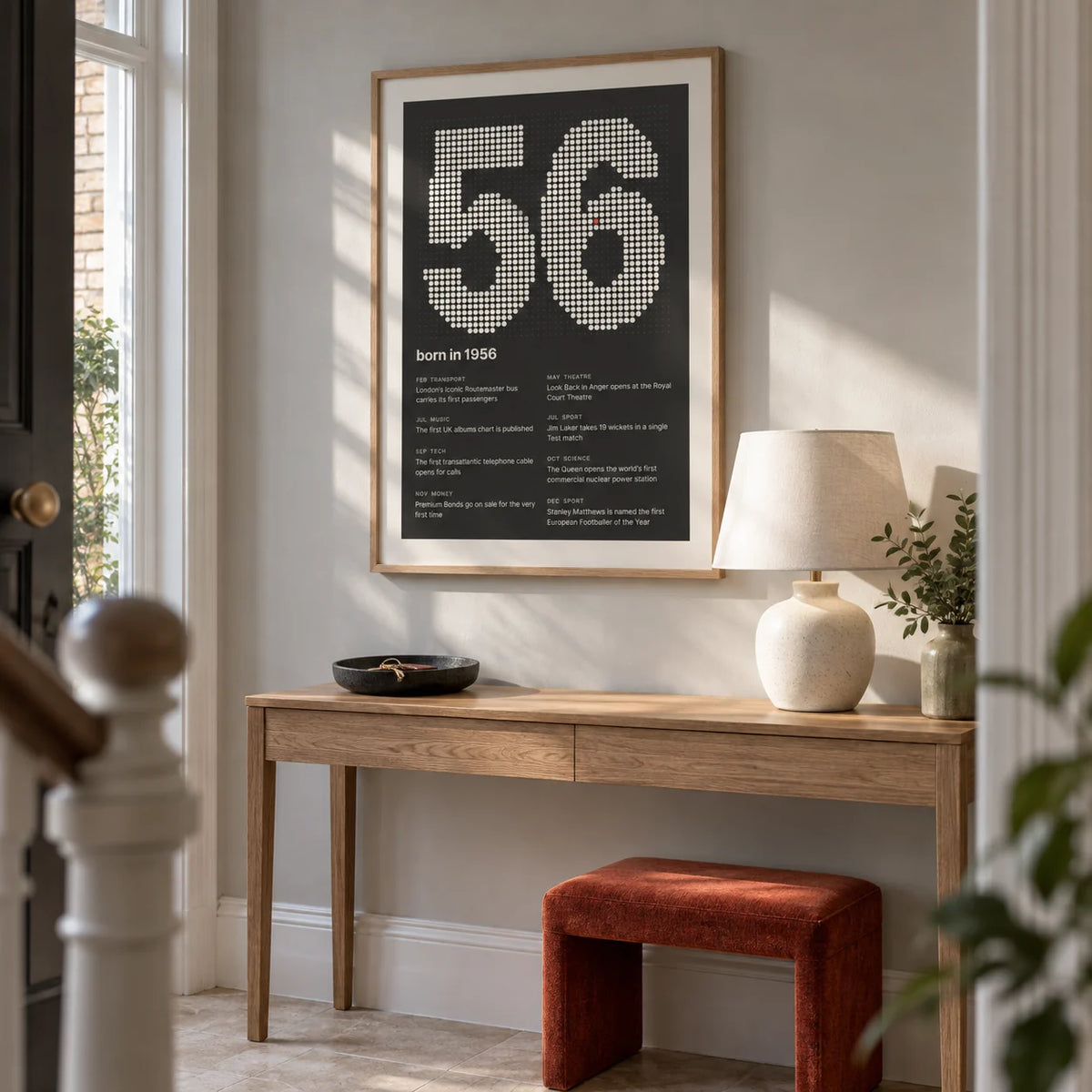 1956 Halftone Print, framed on the wall of a bright entrance hall in a thoughtfully renovated UK terrace with a pale grey wall and plain limestone floor