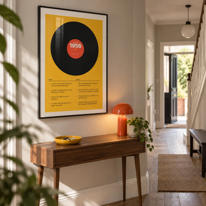 1956 Vinyl Record Print, framed on the wall of a bright entrance hallway in a renovated British terrace with a pale warm grey wall and simple timber floor