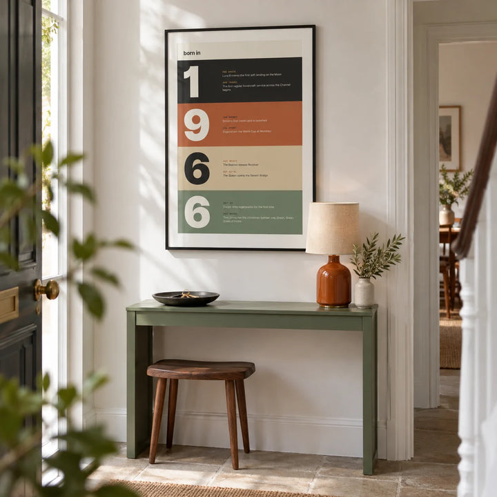 1966 Typography Print, framed on the wall of a bright entrance hallway in a renovated UK terrace with a crisp white wall and plain stone floor