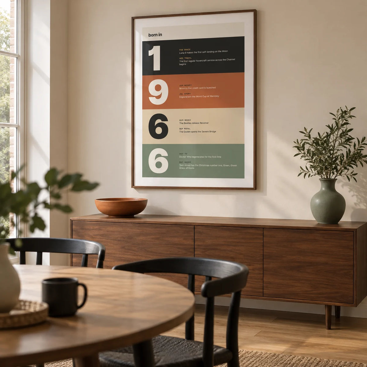 1966 Typography Print, framed on the wall of a modern dining room in a British semi-detached house with a pale sand wall and natural oak floor