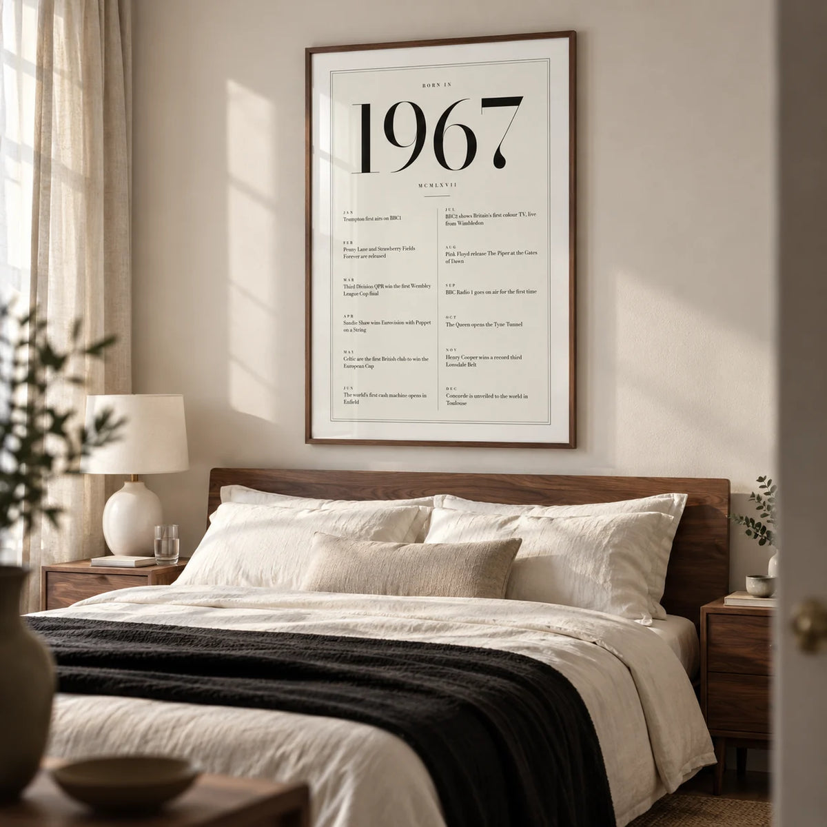 1967 Birthday Print, framed on the wall of a restful grown-up bedroom in a British terrace with a warm white wall and walnut bedside furniture