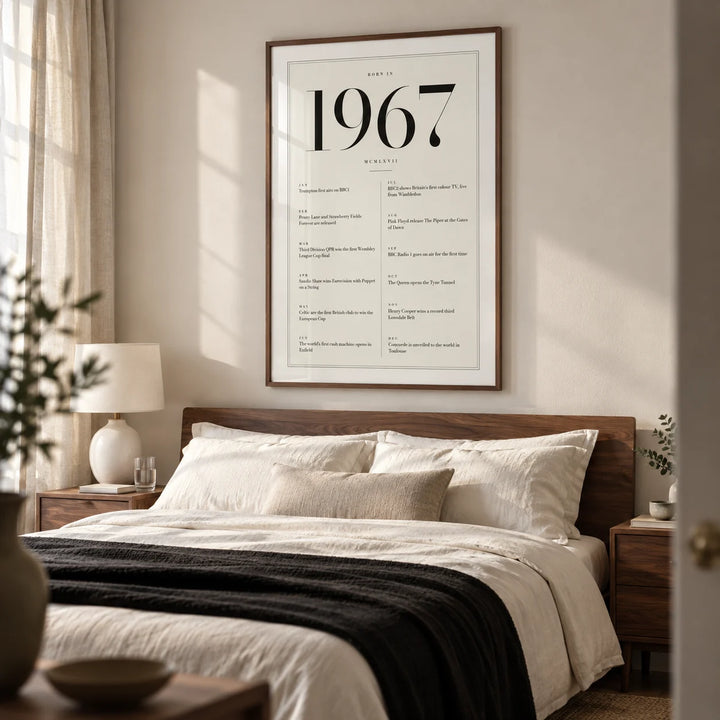 1967 Birthday Print, framed on the wall of a restful grown-up bedroom in a British terrace with a warm white wall and walnut bedside furniture