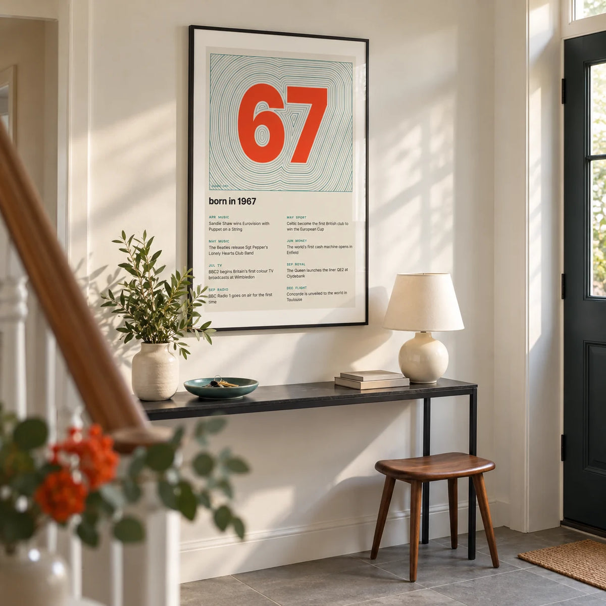 1967 Contour Map Print, framed on the wall of a bright entrance hallway in a UK suburban home with an off-white wall and plain grey stone floor